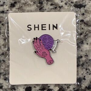 SHEIN Enamel Pin with Pink Hand and Purple Sphere